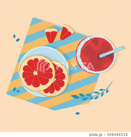 Sliced grapefruit on plate and grapefruit juice in glass jar with straw 108488318