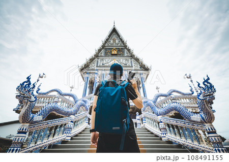 Traveler man in Thai temple 108491155