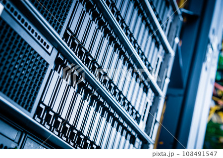 Row of hard disks used for data storage in internet data center Row of hard disks used for data storage in internet data center 108491547