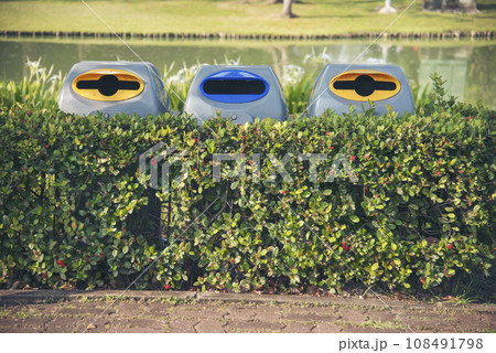 Trash cans for sorting garbage recycle bin waste plastic container collection. Reuse, reduce, recycle sorting process sustainable lifestyle rubbish dustbin plastic box in green garden. Trash cans for sorting garbage recycle bin waste plastic container collection. Reuse, reduce, recycle sorting process sustainable lifestyle rubbish dustbin plastic box in green garden. 108491798