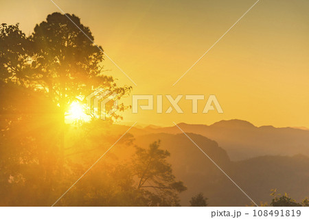 Scenic view dramatic beautiful sunset sky. Natural Sunset Sunrise on meadow silhouette shadow dark land. Vibrant dramatic sky on sunset, dawn, sunrise in Countryside. Landscape Colorful Sky At Sunset 108491819