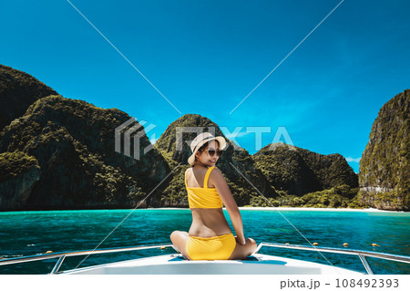 Traveler asian bikini woman relax and travel on boat in Maya Bay Phuket Thailand 108492393