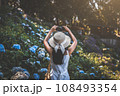 Traveler woman with mobile phone travel in flower garden at Chiang Mai Thailand 108493354