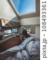 Travel woman with mobile phone relax inside a camper car recreational vehicle 108493361