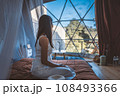 Travel woman relax inside a luxury camping dome tent 108493366
