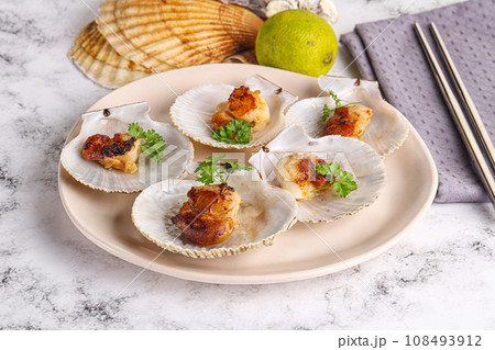 Grilled scallops shell with butter Grilled scallops shell with butter 108493912