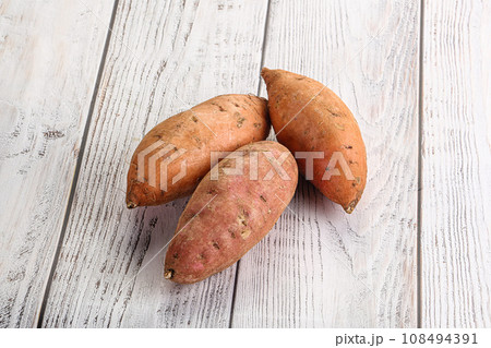 Raw ripe sweet potato heap 108494391