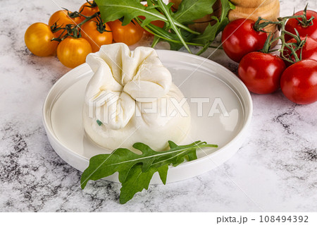 Creamy Italian traditional Burrata cheese Creamy Italian traditional Burrata cheese 108494392