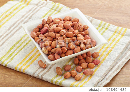 Raw peanut heap in the bowl 108494483