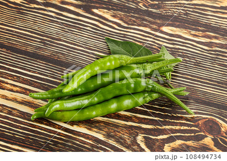Spicy green chili pepper heap Spicy green chili pepper heap 108494734