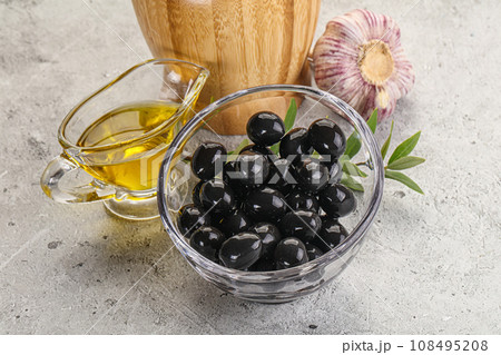 Black olives with oil and branch 108495208