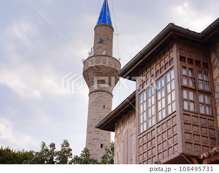 travel to ancient city of Side, Antalya coast of Turkey in tourist low season. mosque against background of cloudy morning sky travel to ancient city of Side, Antalya coast of Turkey in tourist low season. mosque against background of cloudy morning sky 108495731