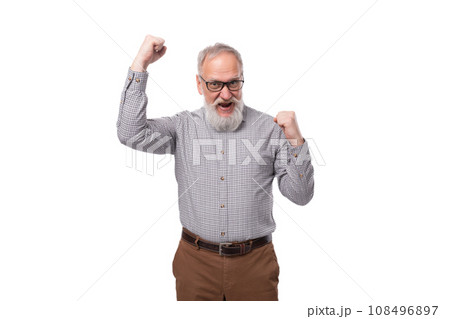 elderly smart boss man with a white beard and mustache works in a business company elderly smart boss man with a white beard and mustache works in a business company 108496897