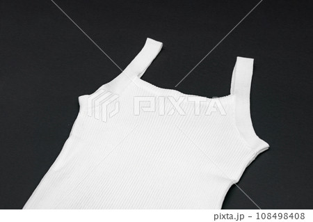 flat White knitwear vest shape on black background with studio light flat White knitwear vest shape on black background with studio light 108498408