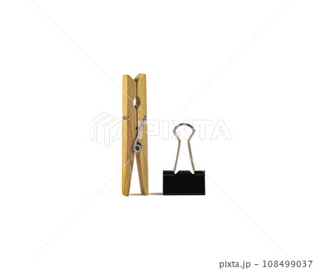 Black metal binder paper clips on an isolated white background Black metal binder paper clips on an isolated white background 108499037