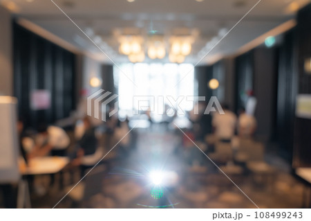 Blurry workshop atmosphere, with a projector in front of the hotel room, is suitable for use as a background image in a presentation. Blurry workshop atmosphere, with a projector in front of the hotel room, is suitable for use as a background image in a presentation. 108499243