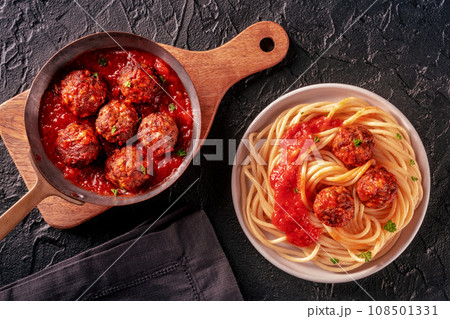 Meatballs. Beef meat balls, overhead flat lay shot in a pan and with spaghetti 108501331
