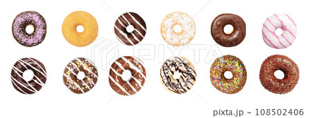 Top view of Donuts collection with colorful sprinkles isolated on white background.  108502406