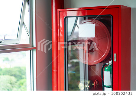 Cabinets of fire protection set is settled with the Emergency Fire Extinguisher and Rolled Pipe Cabinets of fire protection set is settled with the Emergency Fire Extinguisher and Rolled Pipe 108502433