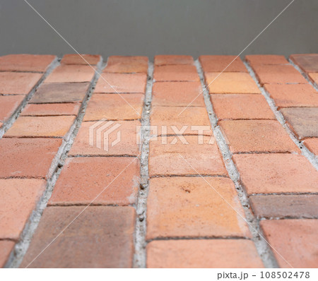 Close up to foam brick board, the element for cover and install with polyurethane glue on the wall 108502478