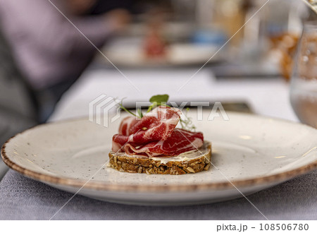 Thinly sliced prosciutto Thinly sliced prosciutto 108506780