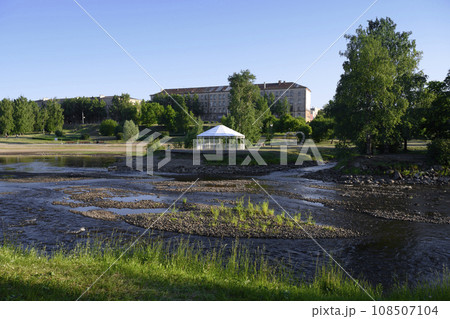 View of the park with a shallow river in the city of Petrozavodsk on a summer evening 108507104