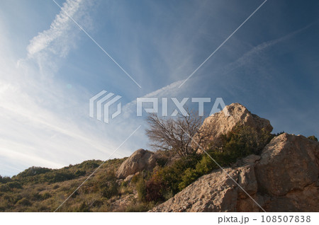 Rocks and vapor trails. Rocks and vapor trails. 108507838