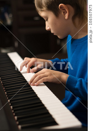 Young Pianist at Practice 108507975