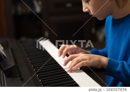 Young Pianist at Practice 108507976