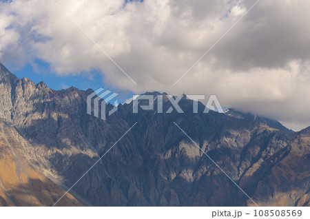 Amazing beautiful mountains landscape in clouds. Travel views of nature Amazing beautiful mountains landscape in clouds. Travel views of nature 108508569