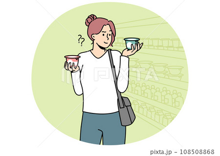 Young woman choose dairy product in supermarket Young woman choose dairy product in supermarket 108508868