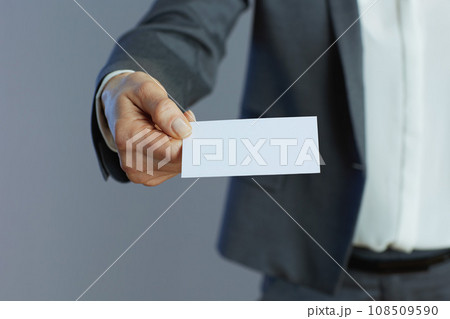 Closeup on woman employee isolated on gray Closeup on woman employee isolated on gray 108509590