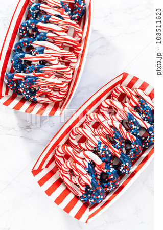 American flag. Red, white, and blue chocolate-covered pretzel twists. 108511623