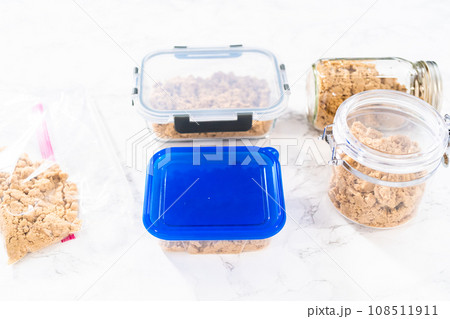 Light brown sugar on a marble counter top. 108511911