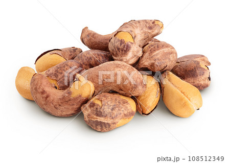 cashew nuts heap with shell isolated on white background 108512349