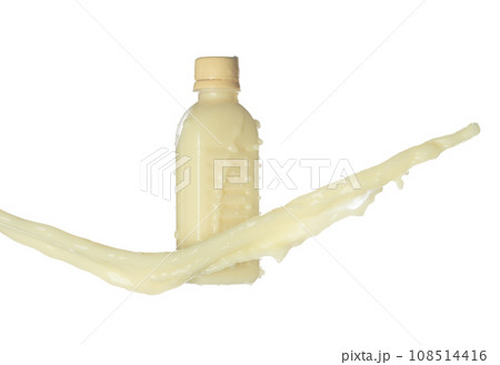 Tofu Soybean soymilk pour fall down in bottle container. Soybean milk or cosmetic cream moisturizer spill splash as paint color. White background isolated high speed shutter freeze motion 108514416