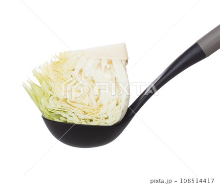 Cabbage put on turner, green fresh vegetable cabbage cut chop half quarter head. Organic fresh vegetable with eaten leaf of cabbage falling, close up texture. White background isolated freeze motion 108514417