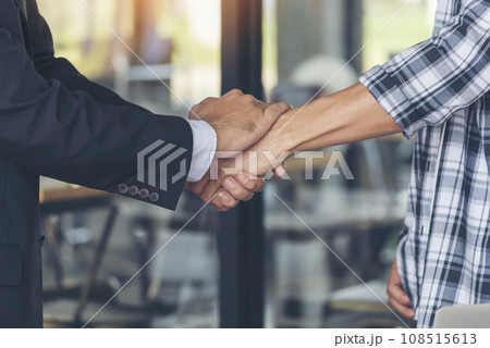 Teamwork partner two men team shaking hands together. Businessman contractor handshake with Business Partner Trust Partnership. Industrail people contractor dealing mission team meeting office desk Teamwork partner two men team shaking hands together. Businessman contractor handshake with Business Partner Trust Partnership. Industrail people contractor dealing mission team meeting office desk 108515613