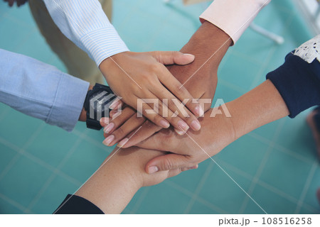 Partners hands together teamwork group of business people meeting in firm company office. Diversity Hands join empower partnership teams connection community. Success Mergers acquisitions partnership 108516258