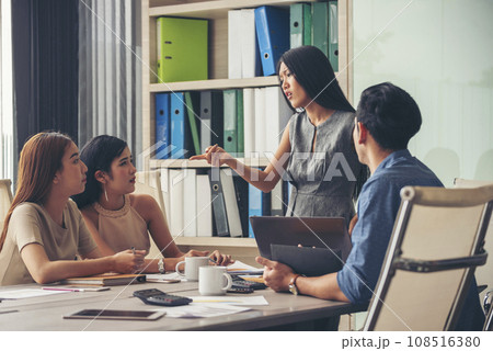 Happy business people meeting present graph chart investment, business data in meeting room. Group of business people meeting in conference room. Asian businessman speech, present teamwork partnership 108516380