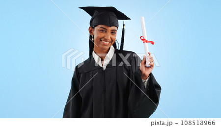 Graduate woman, diploma and portrait in studio with pride, success and achievement by blue background. Graduation, girl and certificate with award, celebration or learning for future from university 108518966