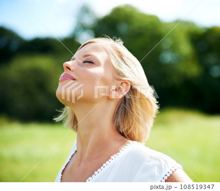 Woman, breathe and calm in nature, peace and zen for inner wellness, summer and relax. Person, mindfulness and serenity in countryside, freedom and healing for mental health, mindset and soul 108519347