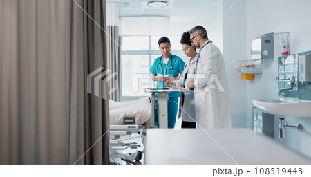 Healthcare, hospital and a medical team of doctors checking on a patient in recovery or rehabilitation. Medicine, teamwork and consulting with a group of health professionals in a clinic for wellness 108519443