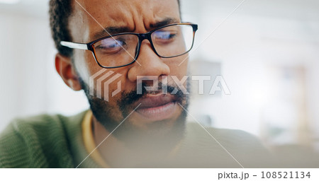 Man, thinking or confused at work laptop or idea, thoughts problem solving. Black person, glasses closeup or job email communication stress or plan doubt, research brainstorming or freelance fail 108521134