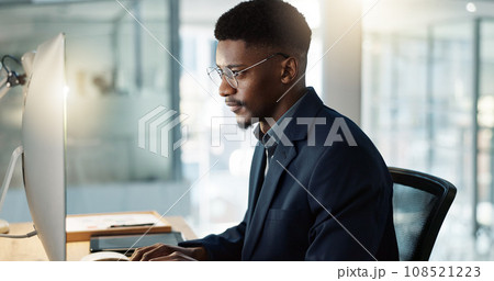 Thinking, businessman and reading on computer with a smile in office for email, feedback or communication. Working, online or black man with research, inspiration or ideas from Nigeria report or news Thinking, businessman and reading on computer with a smile in office for email, feedback or communication. Working, online or black man with research, inspiration or ideas from Nigeria report or news 108521223