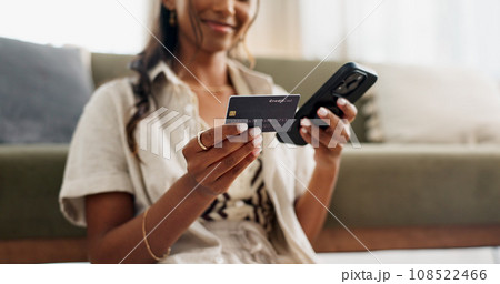 Happy woman, hands and phone with credit card for payment, online shopping or transaction in living room at home. Closeup of female person or shopper on mobile smartphone with debit for ecommerce Happy woman, hands and phone with credit card for payment, online shopping or transaction in living room at home. Closeup of female person or shopper on mobile smartphone with debit for ecommerce 108522466