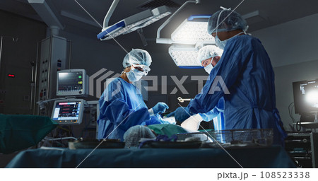 Doctors, team and surgery in theater with medical support for healthcare, safety and operation room at hospital. Surgeon, medicine and teamwork or collaboration with tools for cardiology or emergency Doctors, team and surgery in theater with medical support for healthcare, safety and operation room at hospital. Surgeon, medicine and teamwork or collaboration with tools for cardiology or emergency 108523338