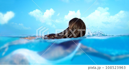 Woman, nature and ocean swimming for travel, holiday and sea water on a tropical island. Hawaii, outdoor and female person relax on a summer vacation with peace and adventure by beach in paradise 108523963