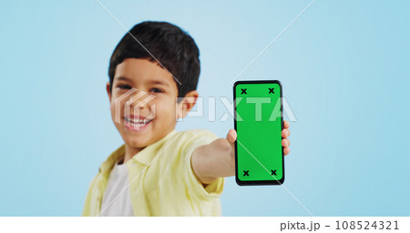 Kid, face or phone green screen in studio on social media for ecommerce, tech or download app logo. Blue background, space or happy child with notification for online marketing, mockup or advertising Kid, face or phone green screen in studio on social media for ecommerce, tech or download app logo. Blue background, space or happy child with notification for online marketing, mockup or advertising 108524321
