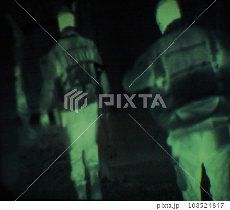 Military, people and green night vision, overlay or dark silhouette of spy, agent or terrorist risk to soldier. Police, surveillance or men training in infrared scope for army or security mission 108524847